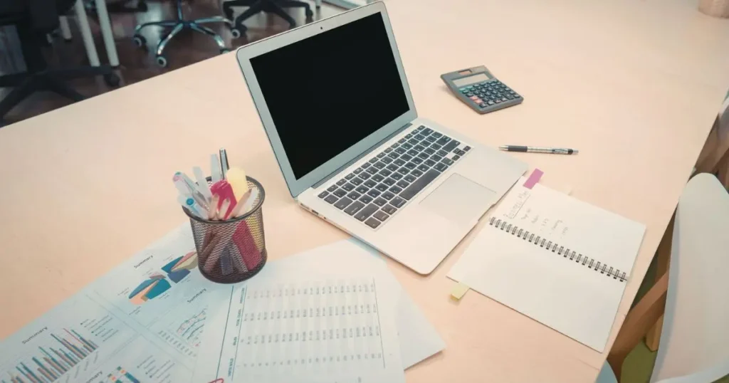Workspace with computer and documents illustrating the role of AI in modern SEO